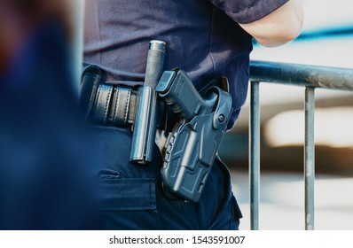 Manhattan 2019. Behind The Police With Gun Belt