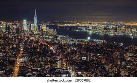 Manhattan aerial panorama cityscape skyline.  Far ahead of the Statue of Liberty can be seen. New York City, USA
