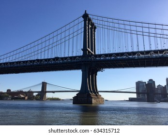 Manhattan Bridge And Brooklyn Bridge Over The East River In Side View