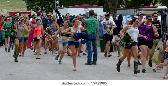 Manhattan, Kansas, USA, 27th June, 2015
Concert Goers Stampede Thru The Gate To Get Front Row Seating At The Annual Kicker Country Stampede Concert At The Tuttle Creek State Park
 