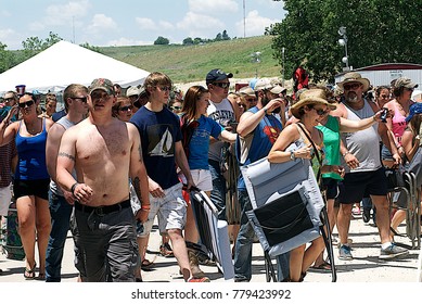 Manhattan, Kansas, USA, 27th June, 2015
Concert Goers Stampede Thru The Gate To Get Front Row Seating At The Annual Kicker Country Stampede Concert At The Tuttle Creek State Park
 