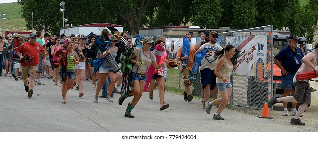 Manhattan, Kansas, USA, 27th June, 2015
Concert Goers Stampede Thru The Gate To Get Front Row Seating At The Annual Kicker Country Stampede Concert At The Tuttle Creek State Park
 