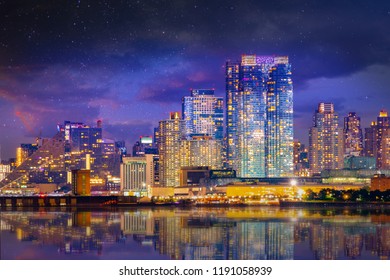 Manhattan midtown skyline at twilight over Hudson river with reflections, New York City - Shutterstock ID 1191058939