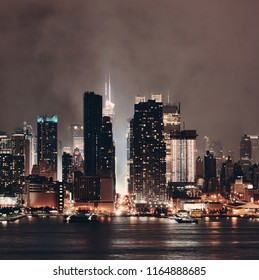 Manhattan Midtown Skyscrapers And New York City Skyline At Night With Fog