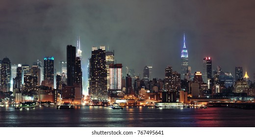 Manhattan Midtown Skyscrapers And New York City Skyline Panorama At Night With Fog