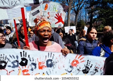 Manhattan, New York City / USA - March 24th 2018: March For Our Lives. Portrait Of African American Teen Protesting Holding Sign. Screaming