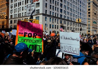 Manhattan, New York City / USA - March 24th 2018: March For Our Lives. Central Park West - Two Big Banners, Gun Owner For Common Sense