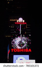 Manhattan: New York, January 1, 2018: The Ball Drop Billboards On Buildings At Times Square In Nighttime