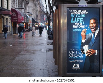 Manhattan, New York, NY, USA - Jan 12 2015: An Outdoor Billboard At A Bus Stop. Ordinary Scene Of The Street In The Upper West Side Area. Rainy Day In The Winter.