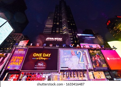 Manhattan, New York, NY, USA. December 3, 2019. Winter Rainy Night On Broadway At Times Square, Tourist Destination, Entertainment Center, And Neighborhood In Midtown Manhattan, New York.