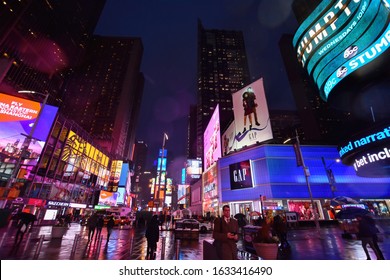 Manhattan, New York, NY, USA. December 3, 2019. Winter Rainy Night On Broadway At Times Square, Tourist Destination, Entertainment Center, And Neighborhood In Midtown Manhattan, New York.