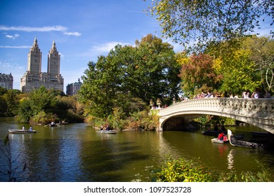 Manhattan, New York, October, 2017: people on boats and Bow bridge in early autumn - Shutterstock ID 1097523728