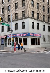 Manhattan, New York / USA - Jan 12 2019: Pedestrians passing by Toms Restaurant, location setting for the Monks Coffee Shop, used as meeting place for the characters in the TV sitcom Seinfeld on NBC