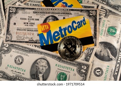 Manhattan, New York, USA - March 26. 2021: Bitcoin On NYC Metro Card And Dollar Banknotes. Purchasing Public Transport Ticket With Cryptocurrency Or US Dollar. Digital Currency With MetroCard