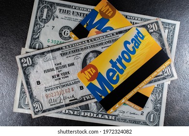 Manhattan, New York, USA - March 26. 2021: NYC Metro Card On Top Of Old Twenty Dollar Bill From The Federal Reserve Bank Of New York. MTA Transit Ticket For Subway On Cash And Banknotes