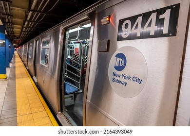Manhattan, New York, USA - March 2, 2022: Train with open doors in a Subway station