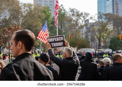 Manhattan, New York, USA - November 11. 2019: Trump protester on Madison square Park in NYC on Veterans Day after Donald Trump speech. Impeach Trump sign