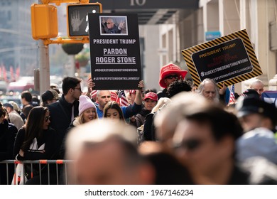 Manhattan, New York, USA - November 11. 2019: Pardon Roger Stone Signs Held Up During Veterans Day Parade In NYC. Call For President Trump To Pardon Roger Stone