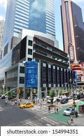 MANHATTAN, NY - JUL 8: From The Red Steps On Broadway & 47th St  (the Northern Triangle Of Times Square) View Of Stock Market Ticker Tape On Office Building Of Morgan Stanley. NYC Jul 8, 2013.