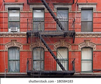Manhattan, old  building with fire escapes