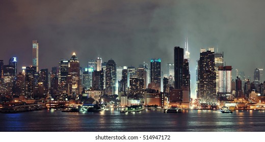 Manhattan Panorama Midtown Skyscrapers And New York City Skyline At Night With Fog