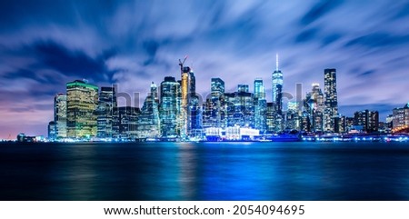 Manhattan panoramic skyline at night. New York City, USA. Office buildings and skyscrapers at Lower Manhattan (Downtown Manhattan).
