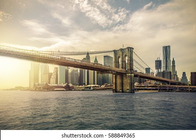 Manhattan Skyline with Brooklyn Bridge, New York City, USA, with lens flare
