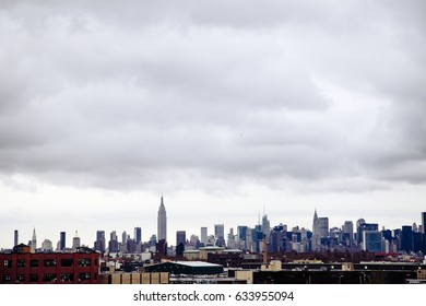 The Manhattan Skyline As Seen From A Brooklyn Rooftop Onan Inclement Day.