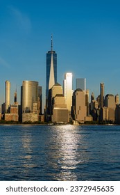 manhattan skyline in sunset. new york city. skyscraper building of nyc. ny urban city architecture. midtown manhattan and hudson river. metropolitan city cityscape. new york downtown in sunlit - Shutterstock ID 2372945635
