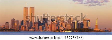 Manhattan skyline with World Trade Center and Statue of Liberty in New York City, NY