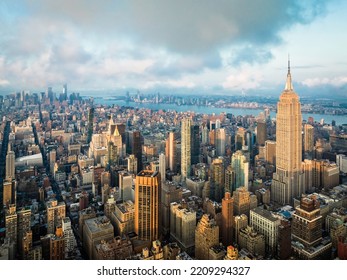 Manhattan skyscrapers at sunrise. Aerial skyline view of New York City towards lower Manhattan - Shutterstock ID 2209294327
