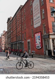 MANHATTAN, UNITED STATES - Oct 05, 2021: A Vertical Shot Of A Person Wandering Around The Seaport In NYC