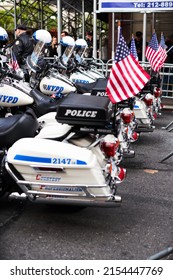 Manhattan, USA - 11. November 2021: NYPD Police Motorcycles Parked In NYC With US Flags Waving. New York Police Department Bikes