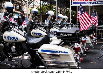 Manhattan, USA - 11. November 2021: NYPD Police Motorcycles Parked In NYC With US Flags Waving. New York Police Department Bikes