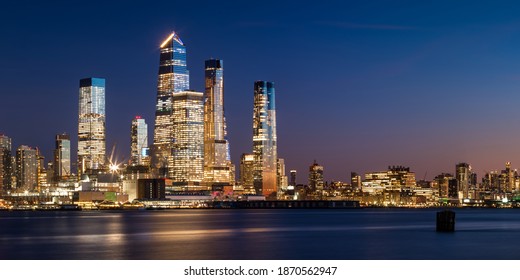Manhattan West skyline at sunset with Hudson Yards skyscrapers and West Village buildings. Cityscape from across Hudson River, New York City, NY, USA