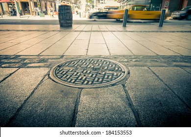 Manhole drain cover on streets of lower Manhattan