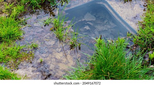 Manhole Drainage Grates On The Lawn With Green Grass Septic Tank Cover, Sump Cesspool Drainage System Environment Design Side View With Copy Space, Nobody.