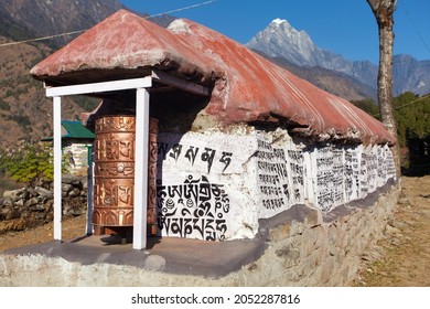 Mani prayer walls and prayer wheels in Khumbu valley near Lukla town, Solukhumbu, way to Everest base camp, Nepal Himalayas mountains