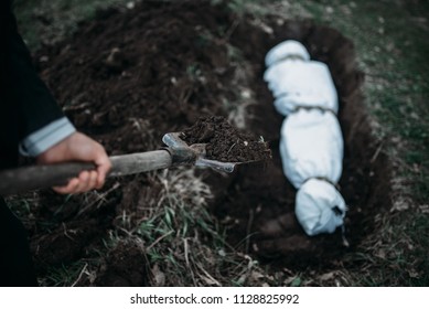 Maniac buries victim into a grave, crime horror