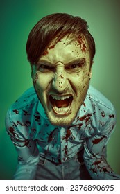 Manic split personality. A psychopathic crazy man, splattered with blood. Horror, thriller.