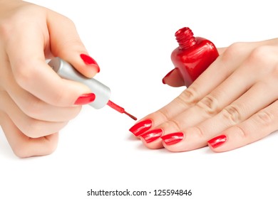 Manicure. Applying Red Nail Polish