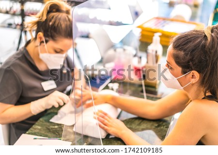 Manicure beauty salon with security measures. Reopening after the corod-19 pandemic. Manicure and Pedicure Salon. Coronavirus
