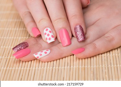 Manicure - Beauty Treatment Photo Of Nice Manicured Woman Fingernails. Feminine Nail Art With Nice Glitter, Pink And White Nail Polish. Selective Focus.