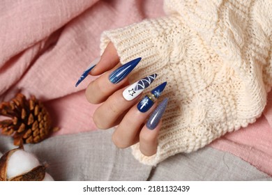 Manicure - Beauty treatment photo of nice manicured woman fingernails. Very nice feminine nail art with polka dots and bow detail. - Shutterstock ID 2181132439