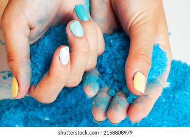manicure with blue nails and seasalt close up like heart, love for summer