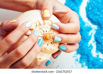 manicure with blue nails and seasalt close up like heart, love for summer
