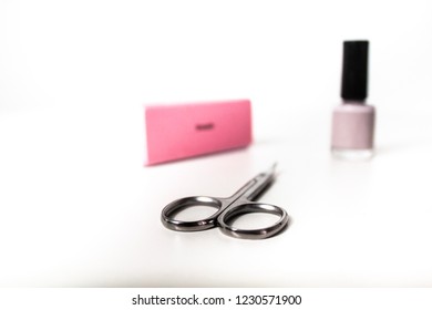 Manicure Nail Scissors, Nail File / Buffer And Nail Polish Isolated On White Background
