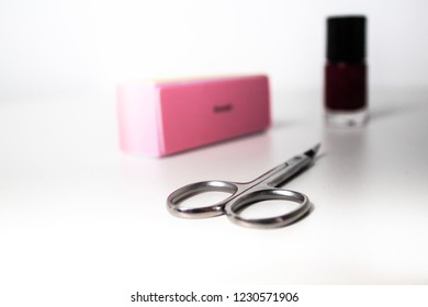 Manicure Nail Scissors, Nail File / Buffer And Nail Polish Isolated On White Background
