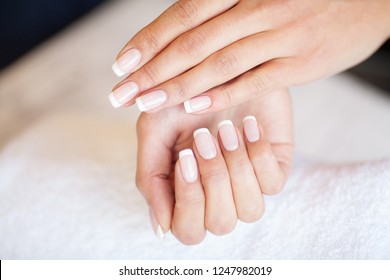 Manicure. Nails master doing manicure in beauty studio. - Powered by Shutterstock