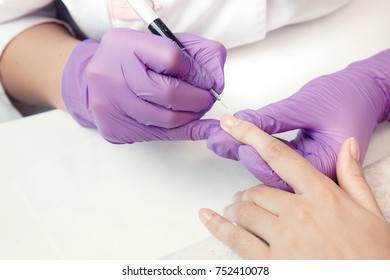 Manicure. Nails Saloon Woman Applying Nail Polish